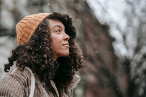 woman-looking-upwards-snow-pexels-miriam-alonso-7585782(https-::www.pexels.com:photo:contemplative-ethnic-woman-admiring-snowfall-in-city-7585782:)