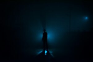 man-silhouette-blue-light-darkness-zanyar-ibrahim-6a27CkTmYoE-unsplash(https-::unsplash.com:photos:a-person-standing-in-the-dark-with-a-flashlight-6a27CkTmYoE)